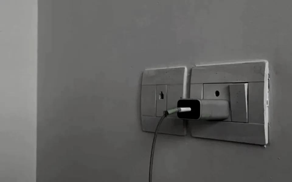 A charger plugged into an ordinary household wall socket